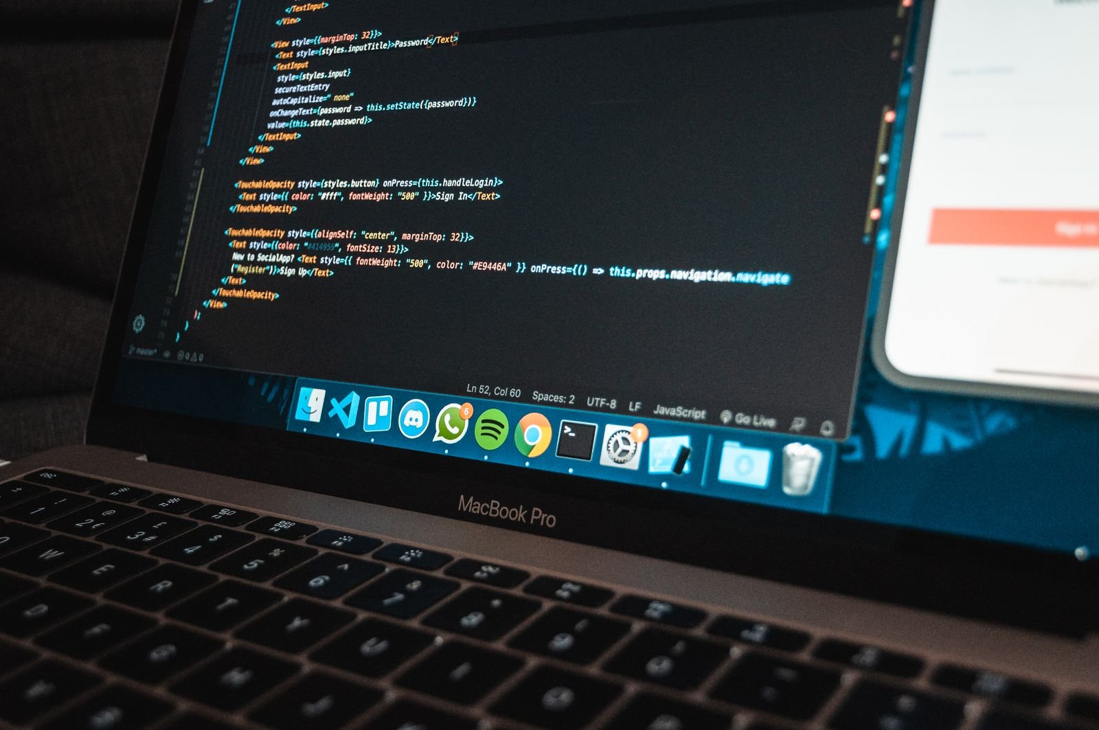 Laptop displaying programming code